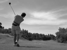 Image: Man playing golf.